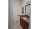 Clean bathroom with granite vanity and tiled floors at 255 David Walker Dr # F5, Tavares, FL 32778