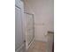 Bathroom with walk-in shower and tiled floor at 255 David Walker Dr # F5, Tavares, FL 32778