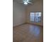 Bright and airy living room with tile floors and ceiling fan at 255 David Walker Dr # F5, Tavares, FL 32778