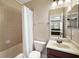 Bathroom with tub, toilet, and vanity at 25833 Feather Ridge Ln, Sorrento, FL 32776