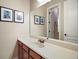 Bathroom with single vanity and mirror at 25833 Feather Ridge Ln, Sorrento, FL 32776