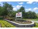 RedTail community sign with landscaping at 25833 Feather Ridge Ln, Sorrento, FL 32776