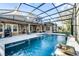 Large screened pool and spa with outdoor kitchen area at 25833 Feather Ridge Ln, Sorrento, FL 32776