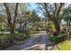 Private long driveway lined with trees leading to a house at 2614 W Ponkan Rd, Apopka, FL 32712