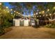 Metal garage with string lights at night at 2614 W Ponkan Rd, Apopka, FL 32712