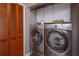 Convenient laundry room with washer, dryer, and storage cabinets at 2614 W Ponkan Rd, Apopka, FL 32712