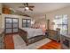 Spacious main bedroom with king-size bed and access to backyard at 2614 W Ponkan Rd, Apopka, FL 32712