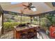 Outdoor kitchen with granite countertop and seating for three at 2614 W Ponkan Rd, Apopka, FL 32712