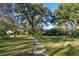 Landscaped pathway winding through a backyard garden at 2614 W Ponkan Rd, Apopka, FL 32712