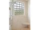 Shower with glass block window and built-in seat at 26148 Avenida Las Colinas # 3B, Howey In The Hills, FL 34737