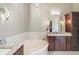 Elegant bathroom with a corner soaking tub and granite countertops at 26148 Avenida Las Colinas # 3B, Howey In The Hills, FL 34737