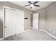 Bedroom with ceiling fan and double door closet at 26148 Avenida Las Colinas # 3B, Howey In The Hills, FL 34737