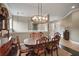 Formal dining room with wood table and chandelier at 26148 Avenida Las Colinas # 3B, Howey In The Hills, FL 34737