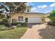 Two-story home with attached garage and landscaped yard at 26148 Avenida Las Colinas # 3B, Howey In The Hills, FL 34737