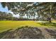 Scenic view of a lush green golf course with mature trees at 26148 Avenida Las Colinas # 3B, Howey In The Hills, FL 34737