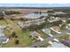 Aerial view showcasing a home nestled in a community by a lake at 26409 Evert St, Leesburg, FL 34748