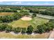 Aerial view of a baseball field surrounded by lush greenery at 26409 Evert St, Leesburg, FL 34748