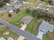 Aerial view of a single-Gathering home in a residential neighborhood at 26409 Evert St, Leesburg, FL 34748