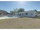 Large backyard with pool and partial home view at 2715 N Dellwood Dr, Eustis, FL 32726