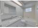 Clean and updated bathroom with granite countertop and a tub shower combo at 2715 N Dellwood Dr, Eustis, FL 32726