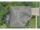 An overhead view of a house with a gray roof and a landscaped yard at 27238 Stoney Brook Dr, Leesburg, FL 34748