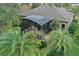 An elevated view of a home with a screened patio and lush landscaping at 27238 Stoney Brook Dr, Leesburg, FL 34748