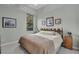 Spacious bedroom with a king-size bed and wood headboard at 27238 Stoney Brook Dr, Leesburg, FL 34748