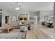 Spacious living room with hardwood floors, neutral color palette, and ample natural light at 27238 Stoney Brook Dr, Leesburg, FL 34748