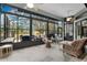 Relaxing sunroom with wicker furniture and tiled floors at 27238 Stoney Brook Dr, Leesburg, FL 34748