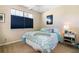 Bright bedroom with a queen-size bed and window coverings at 27527 Briar Patch Pl, Leesburg, FL 34748