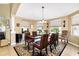 Bright dining room with a glass-top table and seating for six at 27527 Briar Patch Pl, Leesburg, FL 34748