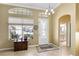 Bright and airy foyer with access to bathroom and living areas at 27527 Briar Patch Pl, Leesburg, FL 34748