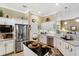 Spacious kitchen featuring stainless steel appliances and granite countertops at 27527 Briar Patch Pl, Leesburg, FL 34748