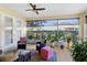 Relaxing screened porch with comfy seating and potted plants at 27527 Briar Patch Pl, Leesburg, FL 34748