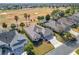 Aerial view of a neighborhood with houses near a golf course at 276 Lawthorn St, The Villages, FL 32162