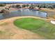 Golf course with pond and green in background at 276 Lawthorn St, The Villages, FL 32162