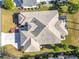 Aerial view of a single-Gathering home with a large backyard and driveway at 276 Lawthorn St, The Villages, FL 32162