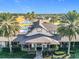 Aerial view of the elegant community clubhouse, featuring a sprawling lawn at 276 Lawthorn St, The Villages, FL 32162