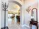 View through entryway to spacious living and dining areas at 276 Lawthorn St, The Villages, FL 32162