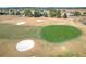 Aerial view of a golf course with sand traps and green at 276 Lawthorn St, The Villages, FL 32162