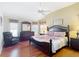 Spacious main bedroom with king-size bed and hardwood floors at 276 Lawthorn St, The Villages, FL 32162