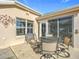 Outdoor patio with metal table and chairs, perfect for dining al fresco at 276 Lawthorn St, The Villages, FL 32162