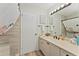 Bathroom featuring modern vanity, tile shower, and ample lighting at 2821 Barboza Dr, The Villages, FL 32162