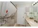 Bright bathroom featuring a tiled shower, neutral tones, and modern fixtures at 2821 Barboza Dr, The Villages, FL 32162