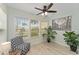 Cozy interior with chair and large windows, providing natural light at 2821 Barboza Dr, The Villages, FL 32162