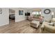 Cozy living room featuring tile flooring, neutral tones, and comfortable seating at 2821 Barboza Dr, The Villages, FL 32162