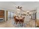 Open living space with dining area, kitchen and patio at 2821 Barboza Dr, The Villages, FL 32162