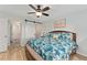 Beautiful main bedroom with barn door leading to bath and walk-in closet at 2821 Barboza Dr, The Villages, FL 32162