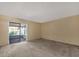 Bright living room featuring sliding glass doors leading to a screened patio at 30036 Tavares Ridge Blvd # 30036, Tavares, FL 32778