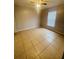 Spacious bedroom with ceiling fan and tile floors at 3236 White Blossom Ln, Clermont, FL 34711